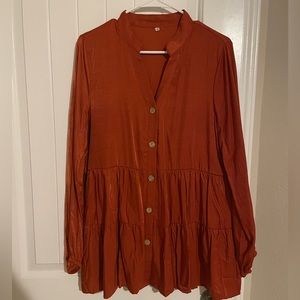 Burnt orange babydoll blouse with functional buttons. Size medium